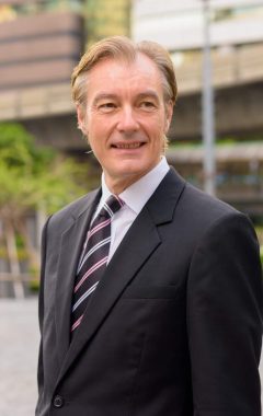 happy-mature-handsome-businessman-thinking-in-the-2021-08-28-03-29-31-utc-Custom-e1643051639361.jpg
